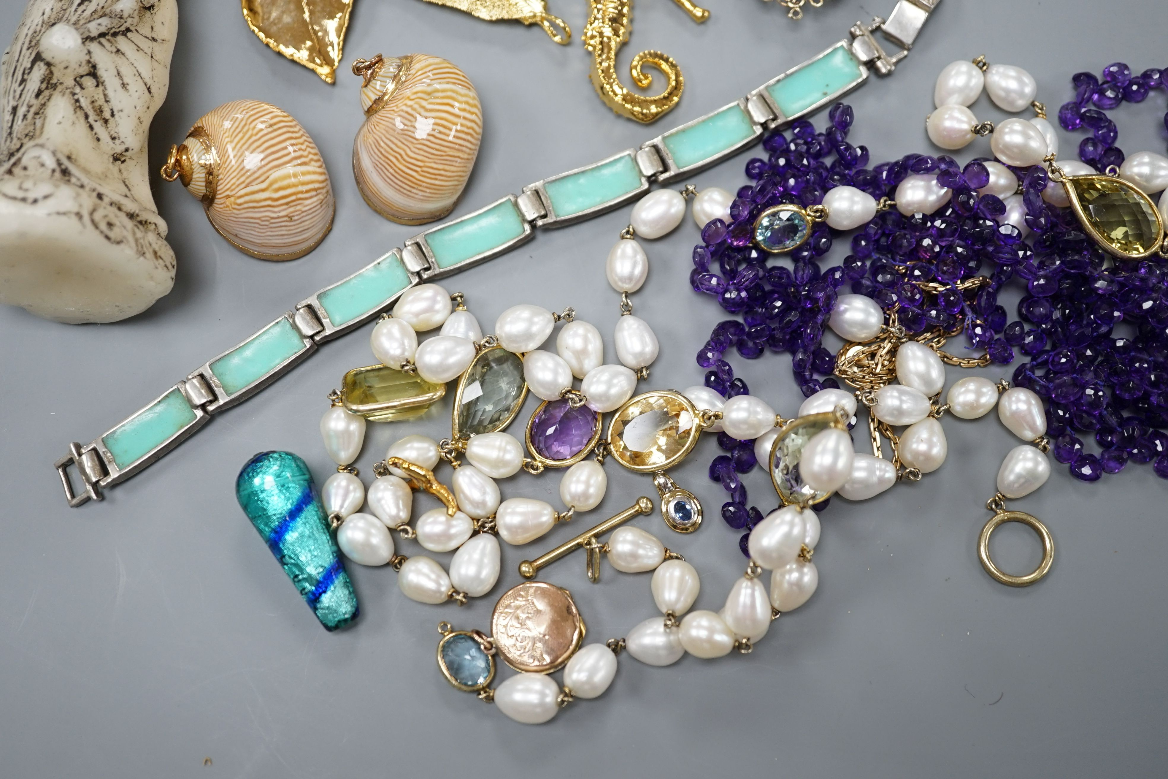 A group of minor costume jewellery including an amethyst bead necklace